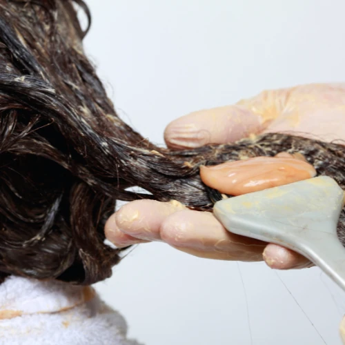 Image of stylist styling a clients hair at Lusso Hair Studio & Spa located in Winston-Salem, NC