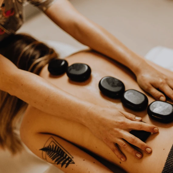 Image of hot stone massage at Lusso Hair Studio & Spa located in Winston-Salem, NC.