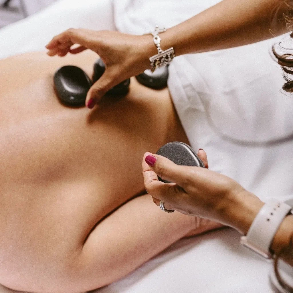 Image of a hot stone massage service at Lusso Hair Studio & Spa located in Winston-Salem, NC.